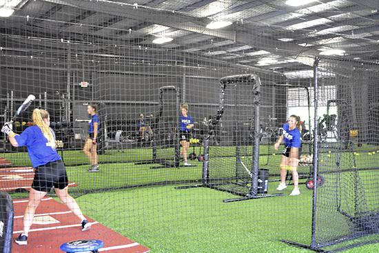 Blinn softball players practicing in the new Coatney Center